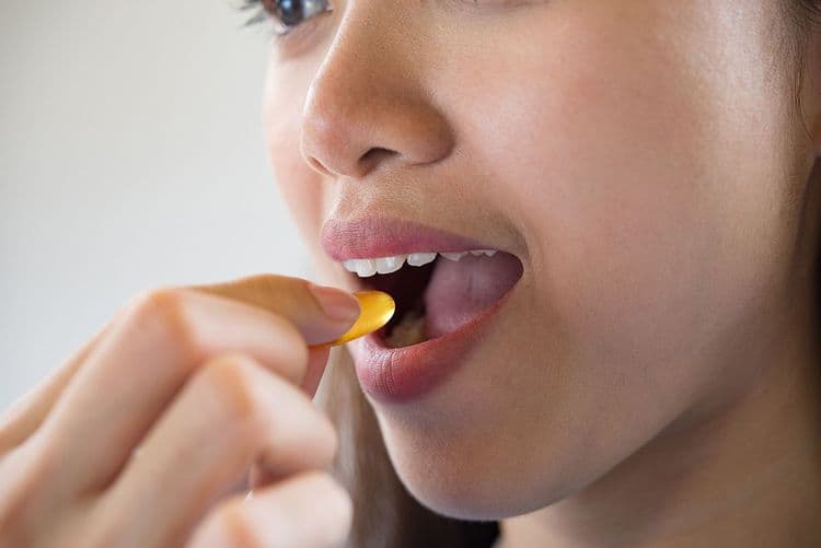 women taking medicine